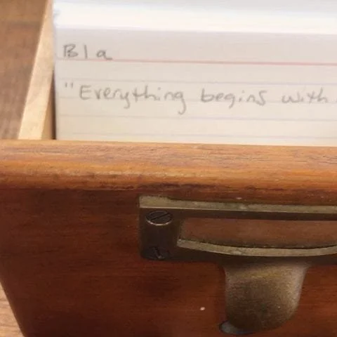 Card catalogue drawer with handwritten notecards inside.