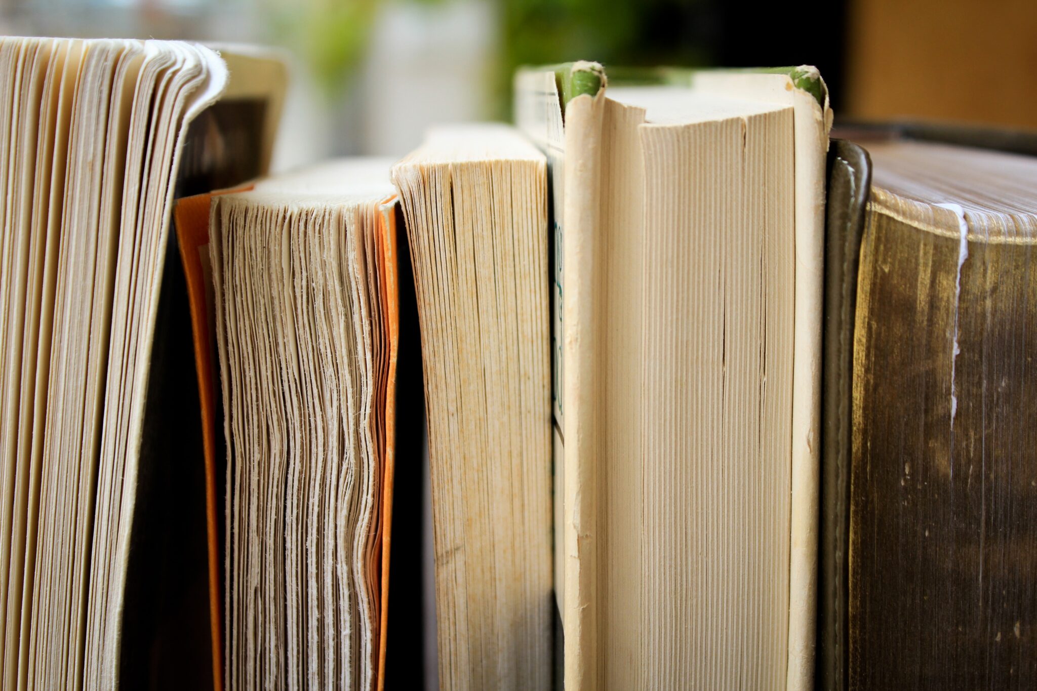Side view of hardcover and paperback books