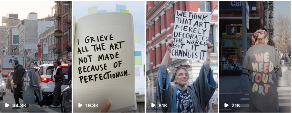 Amie McNee in NYC with a custom wardrobe that says We need your art, holding up signs and showing pages of her book.