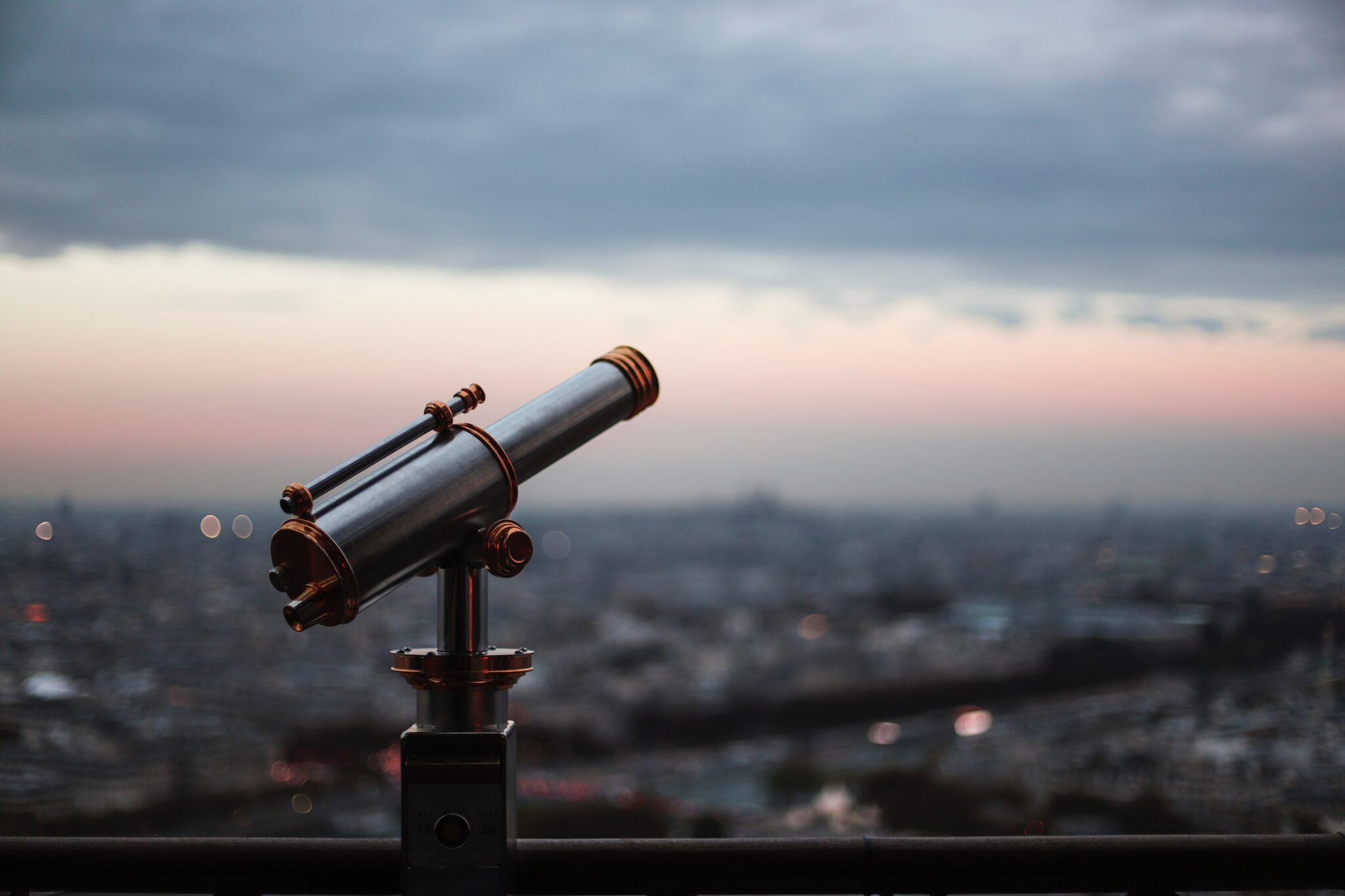 Telescope looks over a city skyline