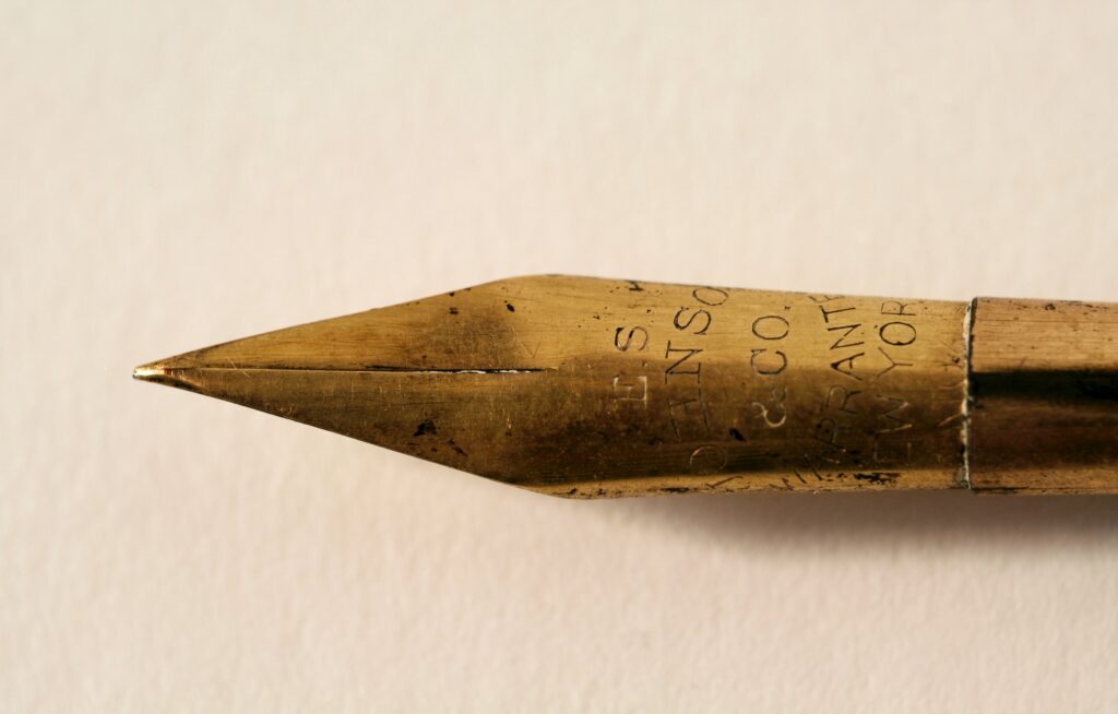 Closeup photo of golden pen nib