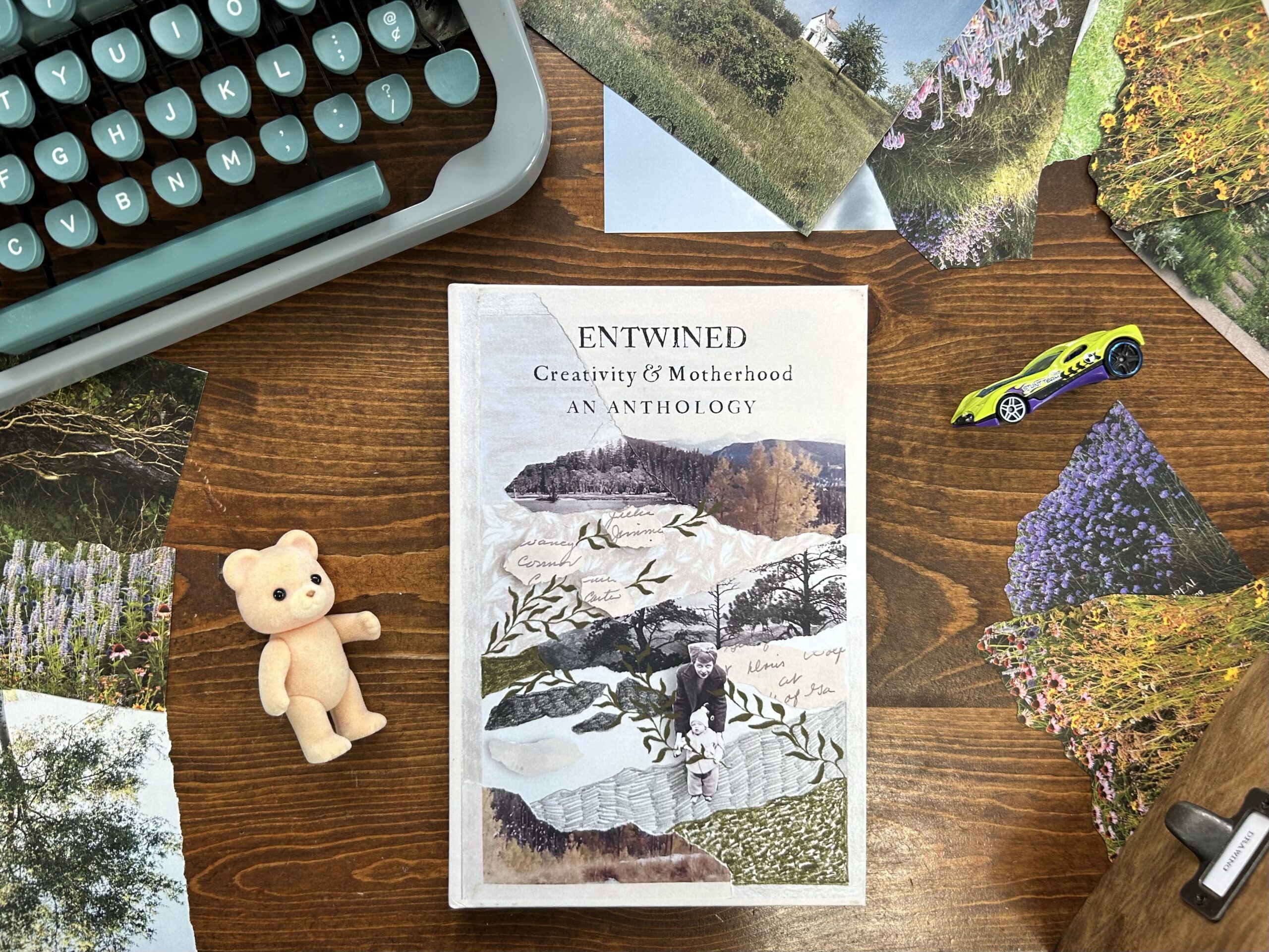 Entwined Anthology with collage of mother and child on desk with typewriter, magazine clippings, teddy bear toy and Hot Wheels car