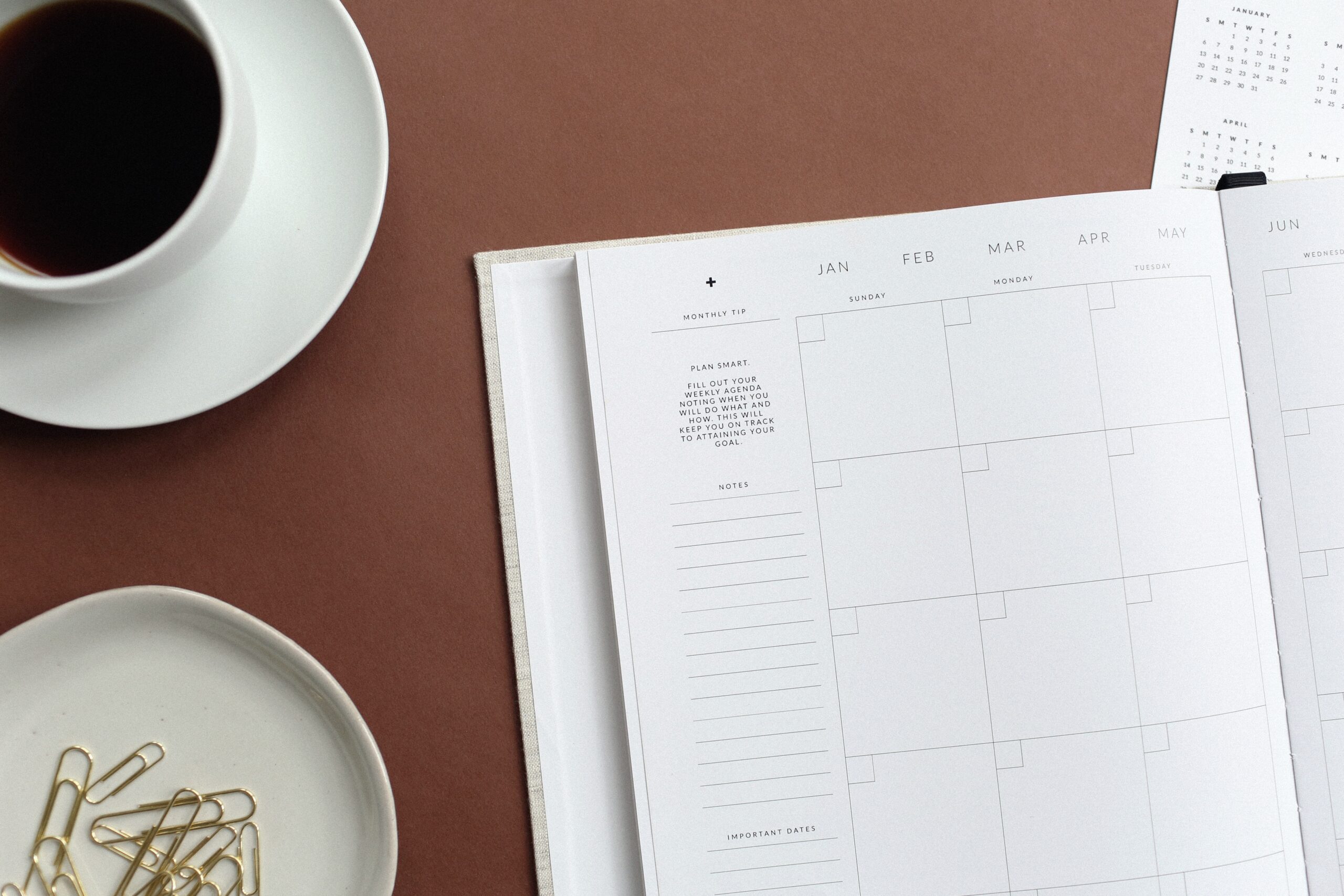 Flatlay of planner and coffee cup
