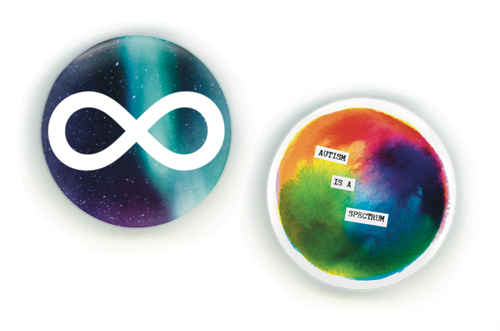 Two round pins. One is a blue and teal nebula with a white infinity symbol. The other is a watercolor wash of rainbow colors in a color wheel spectrum. Typewritten text is collaged on top that says, "autism is a spectrum."