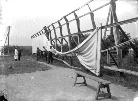 Black and white photograph of the same frame with fabric attached to half of it.