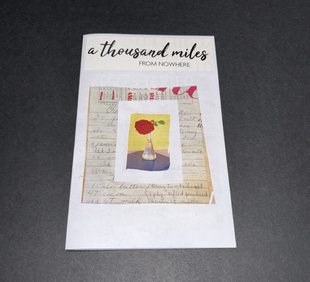 Collaged zine cover reads A thousand miles from nowhere. Handwritten text with dates marked out in red are overlaid with a red flower in a vase surrouned by a handcut white border.